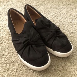 Black bow slip on sneakers
